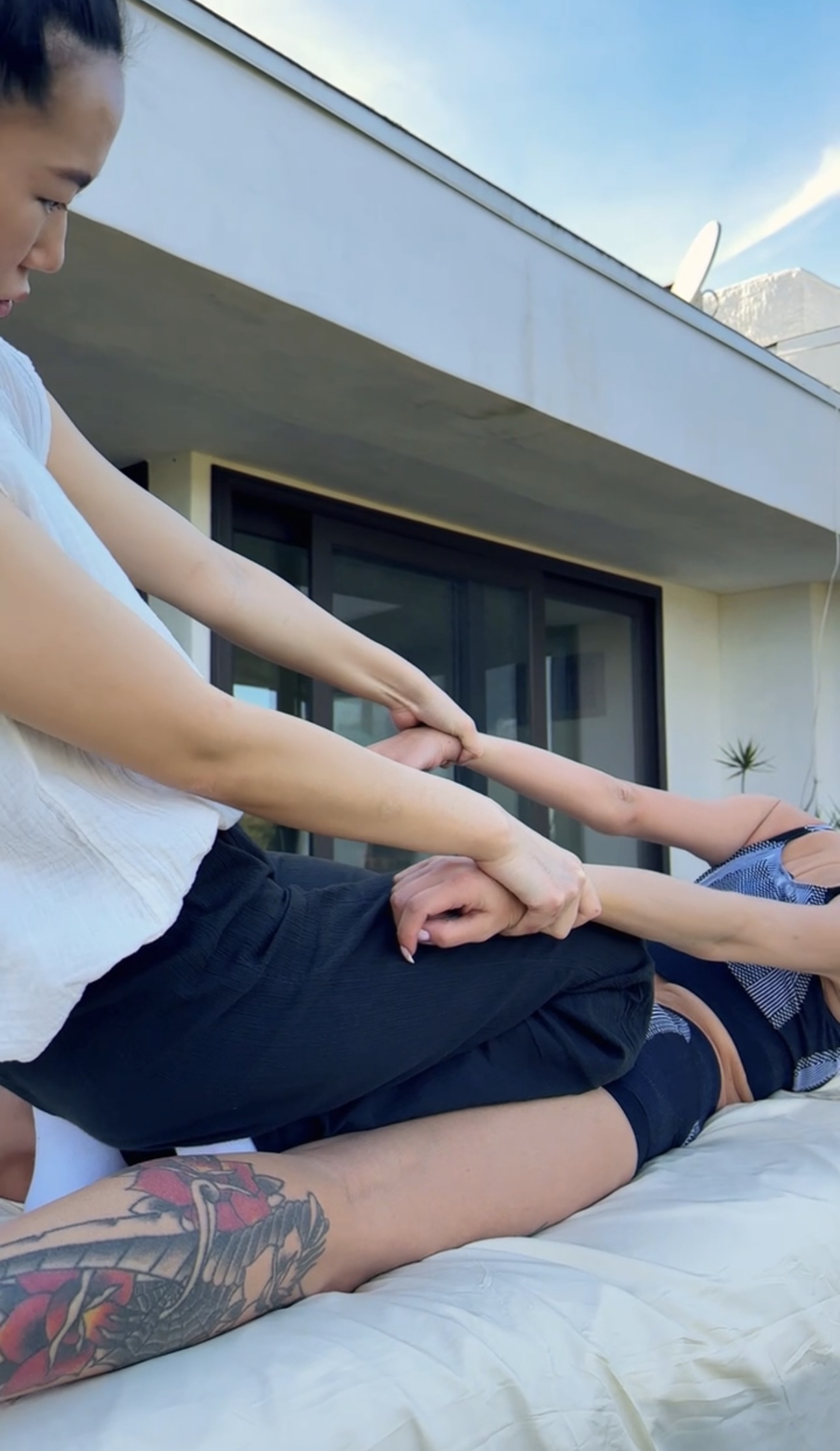 Daroma Wellness — Shoulder and arm work on a rooftop table